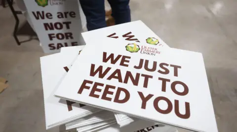 Protest banners at the Ulster Farmers' Union rally at the Eikob Exhibition Centre, Lisburn. They say, we just want to feed you.